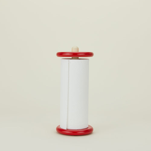 A red and yellow paper towel holder with paper towel roll.