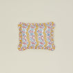 Block printed floral ruffled pillow in mustard.