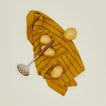 Fodory potato masher with kitchen towel and potatoes