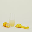 Fox Run lemon juicer with lemons and lemonade in a pitcher