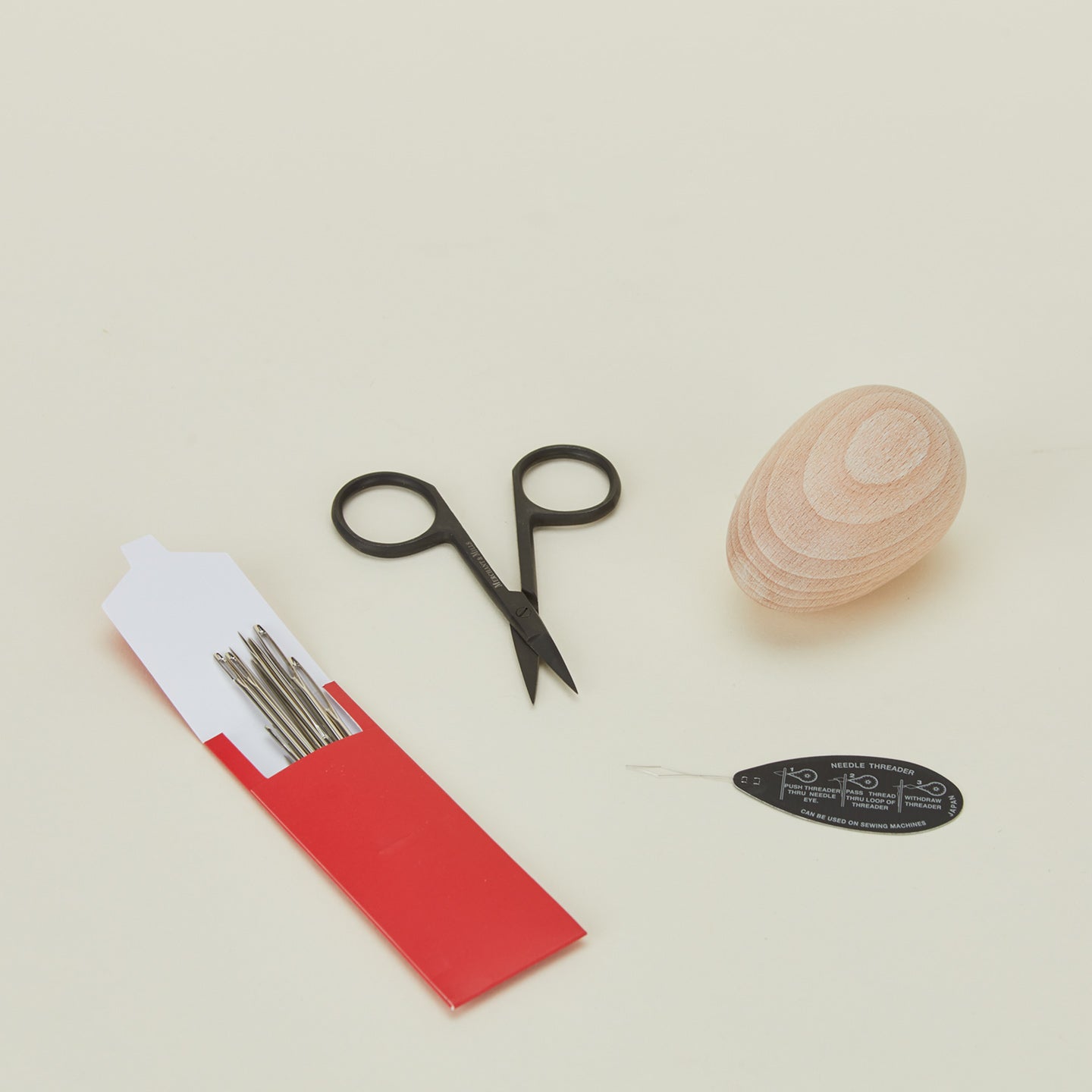 Darn set with needles, scissors, threader, and darning egg 
