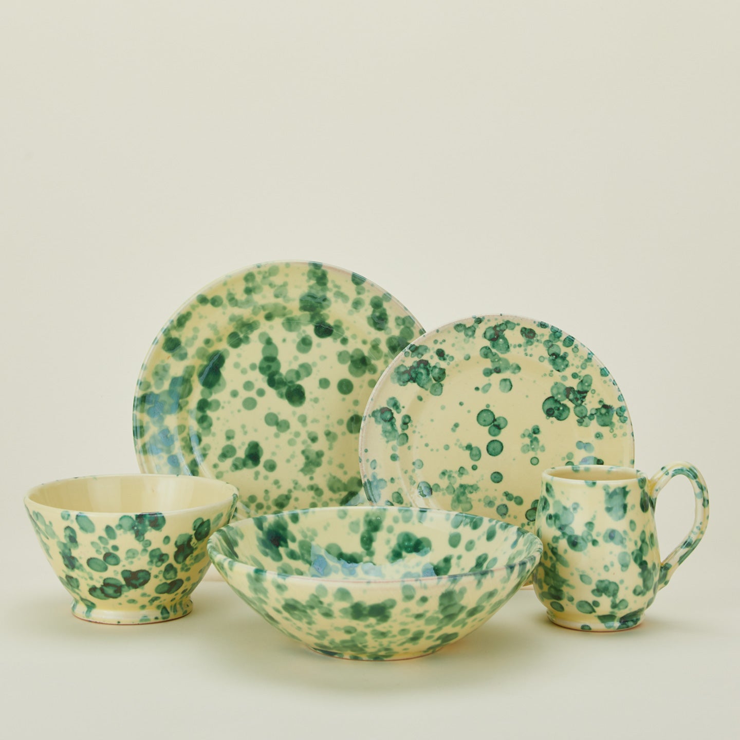 Splatter dinnerware family in yellow and green.