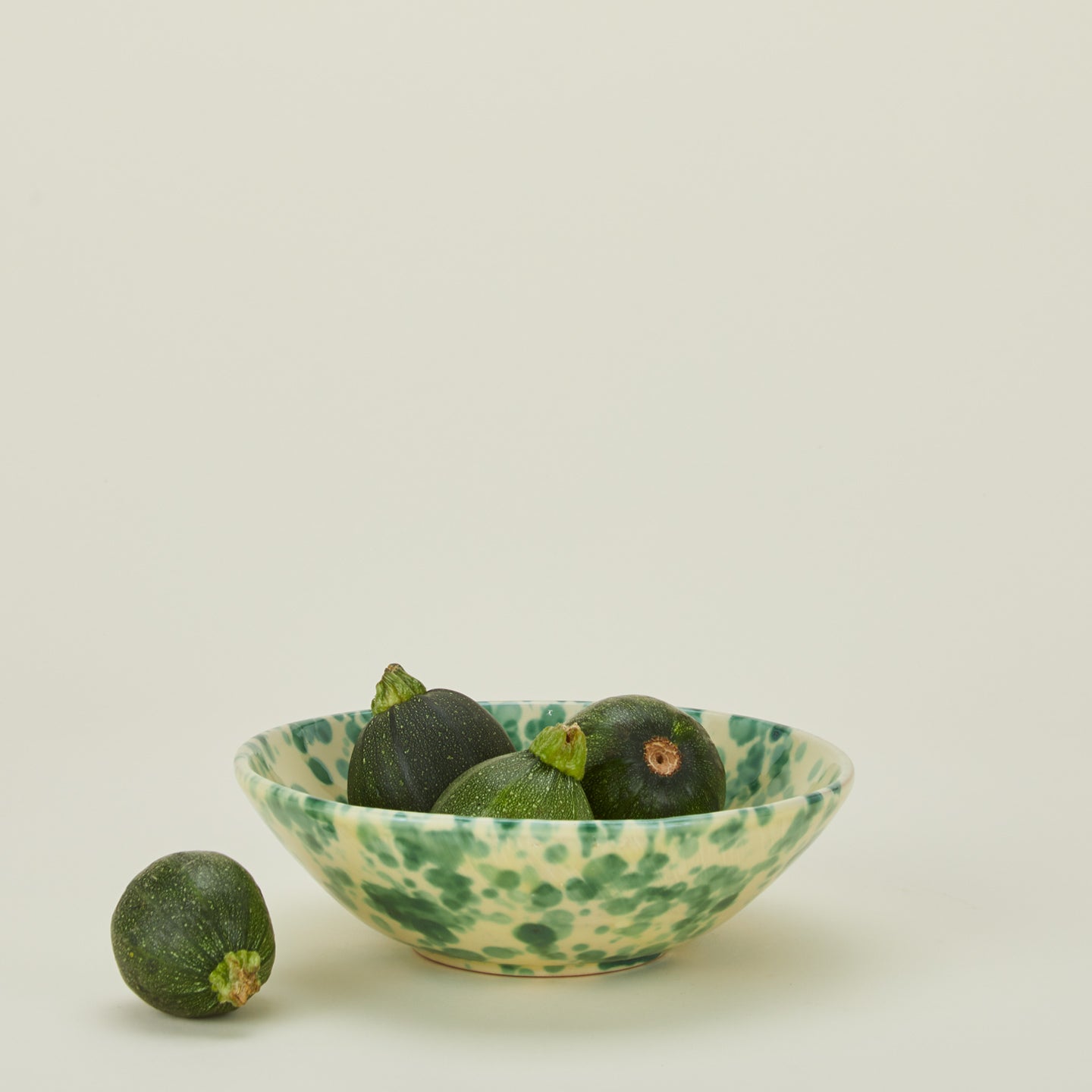 Splatter low bowl in yellow and green with cucumbers
