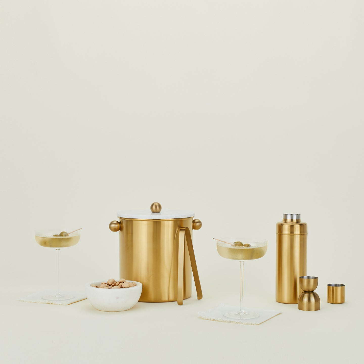 Simple Barware Set with two martinis and a small bowl of pistachios.